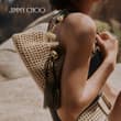 For summer, the signature Cinch bag is presented in hand-woven raffia and finis…