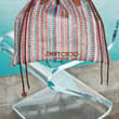 An effortless silhouette and colourful raffia make the Drawstring Tote perfect…