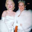 Marilyn Monroe and Betty Grable at a party in 1953.