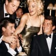 Marilyn Monroe fooling around with Jerry Lewis, Dean Martin and Milton Berle in…