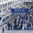 China's railways handled a record 2.348 billion passenger trips in the first ha…