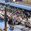 China's railways handled a record 2.348 billion passenger trips in the first ha…
