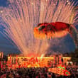 A massive glowing Ao Fish lantern, depicting a mythical Chinese creature with a…