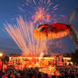 A massive glowing Ao Fish lantern, depicting a mythical Chinese creature with a…
