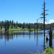 Known for its distinctive table-mountain landform, Wawu Mountain features a sum…