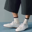 Effortless by design. The Sunny trainer in white leather and the Bar Holdall ba…