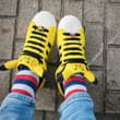 ⚡💛 Pikachu meets striped socks! 🧦👟 Yellow Pokémon sneakers + colorful socks = t…