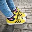 ⚡💛 Pikachu meets striped socks! 🧦👟 Yellow Pokémon sneakers + colorful socks = t…