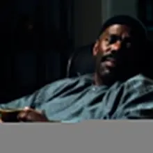 Ali sitting at home with his ceramic mug most likely drinking coffee on a leath…
